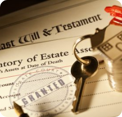 Close-up of a last will and testament, keys, a small house, stacked coins, and a court document stamped "GRANTED," symbolizing estate planning and inheritance.
